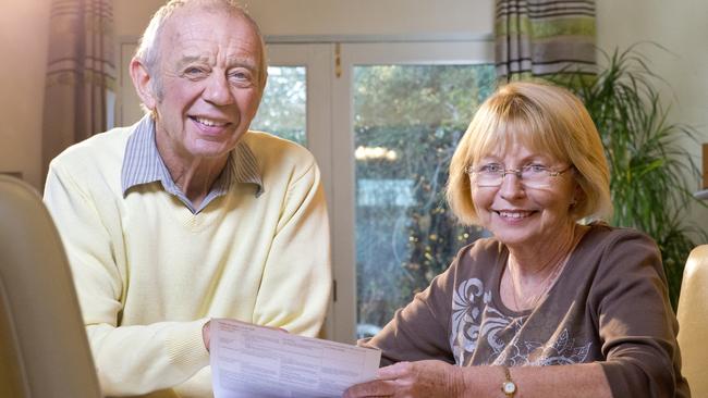 senior couple looking over paperwork; superannuation generic happy