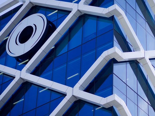 The Macquarie Group Ltd. logo is displayed on the facade of the Macquarie Group Building in Sydney, Australia, on Friday, April 27, 2012. Macquarie Group Ltd., Australia's largest investment bank, said it's relying on cost cuts to revive earnings after a slump in trading income and dealmaking dragged full-year net income to an eight-year low. Photographer: Ian Waldie/Bloomberg