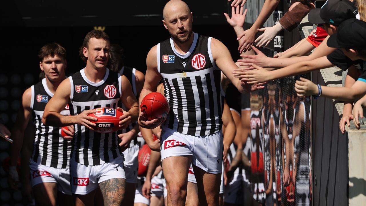 Port Adelaide SANFL captain Cam Sutcliffe leads his team onto Adelaide Oval for this year’s elimination final against Central District. Picture: David Mariuz/SANFL