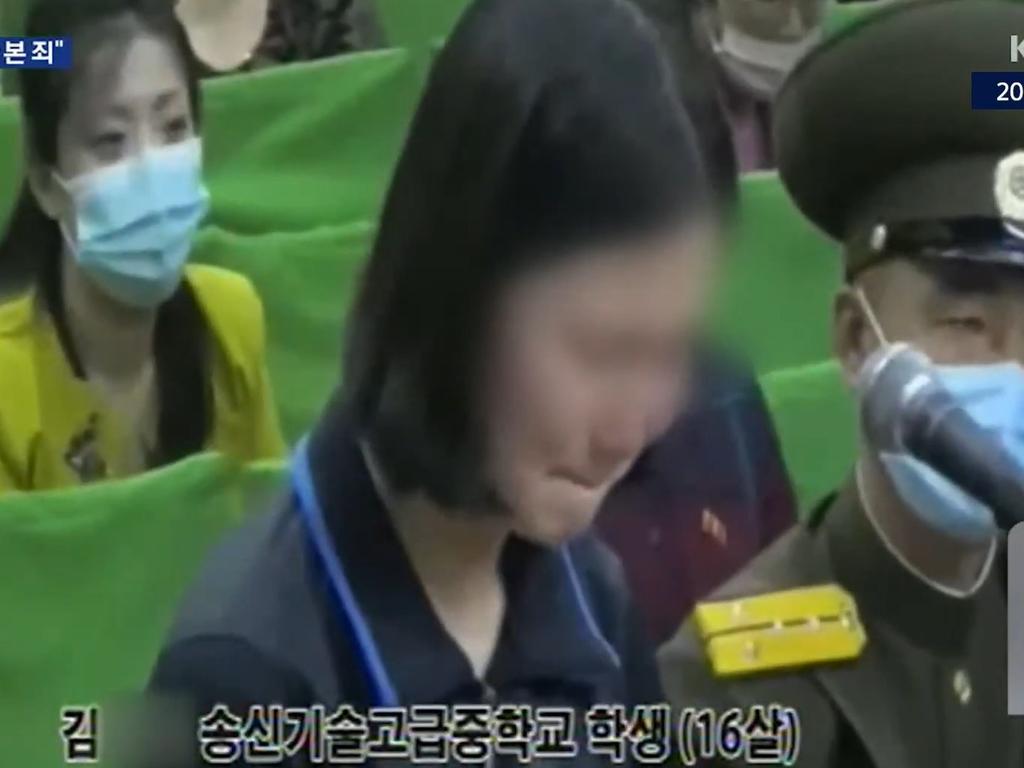 A teenage girl sobs during the public humiliation. Picture: KBS