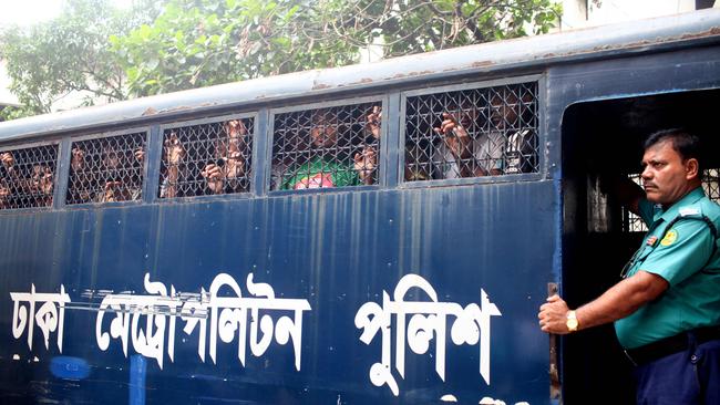 A police van transports protesters to court in Dhaka on Tuesday. Picture: AFP