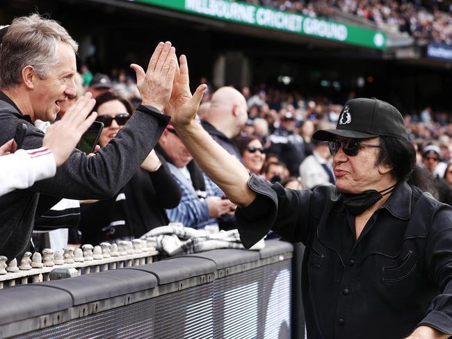 Carlton Blues fan Gene Simmons presents the match-day ball for the clash against the Collingwood Magpies at the MCG. Picture: Michael Klein