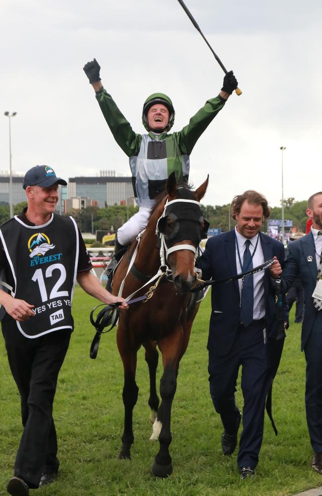 Jockey Glen Boss celebrates as Coolmore Stud's Tom Magnier and part-owner Brae Sokolski lead Yes Yes Yes back to scale after winning the 2019 The TAB Everest. Picture: Grant Guy