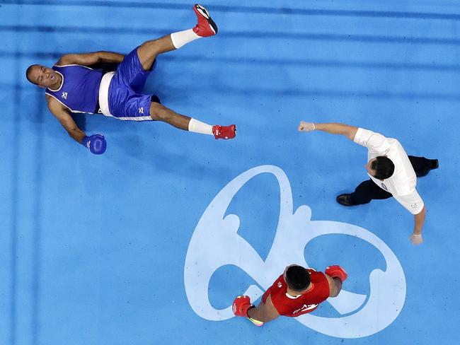 Cape Verde's Davilson Dos Santos Morais is floored by Britain's Joe Joyce in the ring.