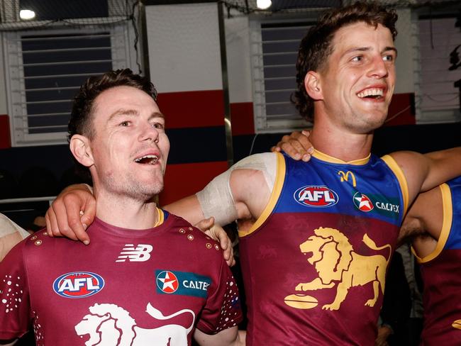 ADELAIDE, AUSTRALIA - APRIL 05: Noah Answerth, Lachie Neale, Jarrod Berry and Callum Ah Chee of the Lions sing the team song during the 2024 AFL Round 04 match between the Brisbane Lions and the North Melbourne Kangaroos at Norwood Oval on April 05, 2024 in Adelaide, Australia. (Photo by Dylan Burns/AFL Photos via Getty Images)