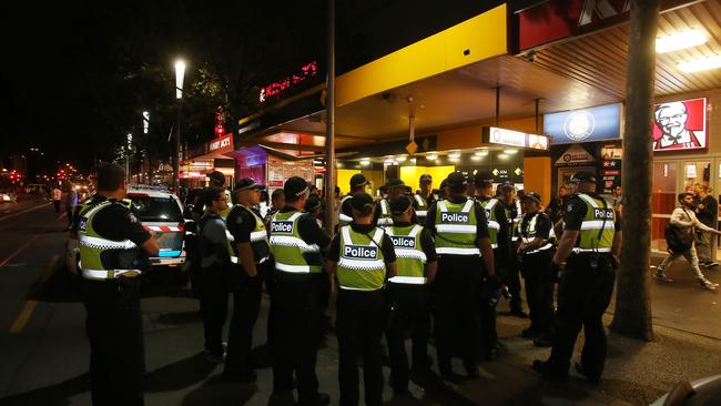 Police gather on Swanston St in response to the Moomba riots.