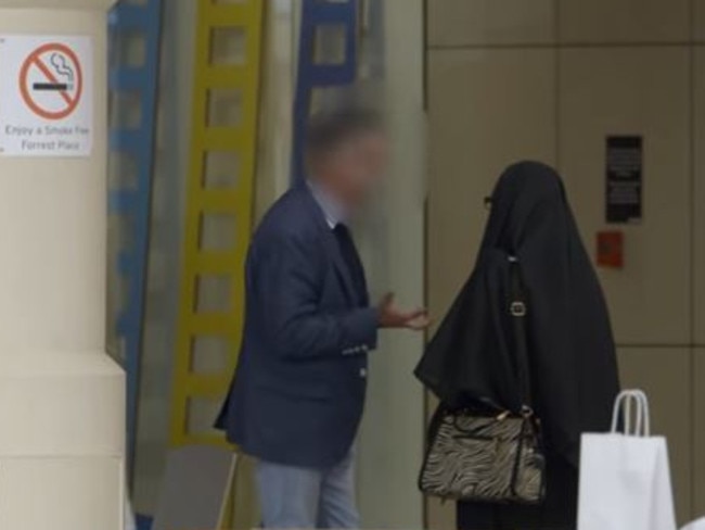 The man swears several times during the encounter and asks Rahila why she won’t show her face. Picture: Screengrab/SBS