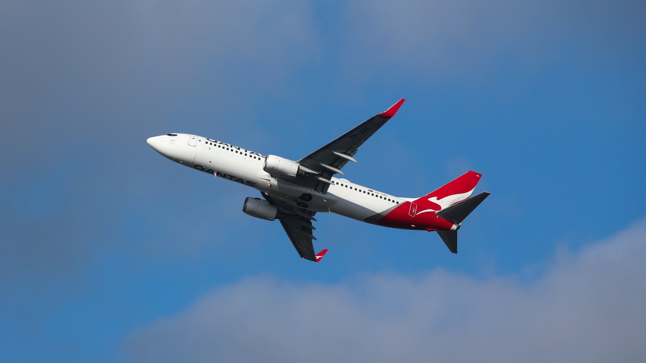 Devastation as young woman dies on Qantas flight