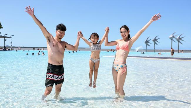 The weather in Cairns has started to warm up, with a long, hot summer forecast for Far North Queensland. Japanese tourists Tsuyoshi Oguri, Nayu Oguri, 3, and Nana Oguri cool off from the Cairns heat by taking a swim in the Cairns Esplanade lagoon. Picture: Brendan Radke