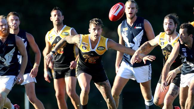 Scott Macleod, of Frankston YCW, has his eyes on the ball against Edi-Asp. Picture: Hamish Blair