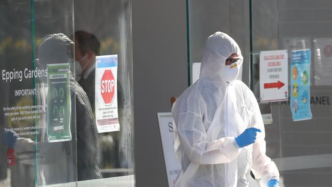 A Victorian health worker is seen at the Epping Gardens Aged Care home last month. Picture: David Crosling