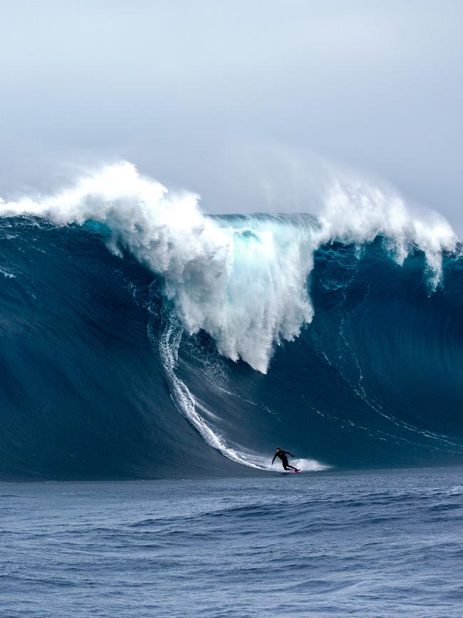 Surfer Tyler Hollmer Cross on one of the biggest and scariest waves ever ridden in Australia, at Tasmania’s Pedra Branca. Picture: Stu Gibson