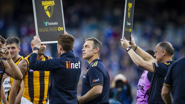 Alastair Clarkson speaks to his players.