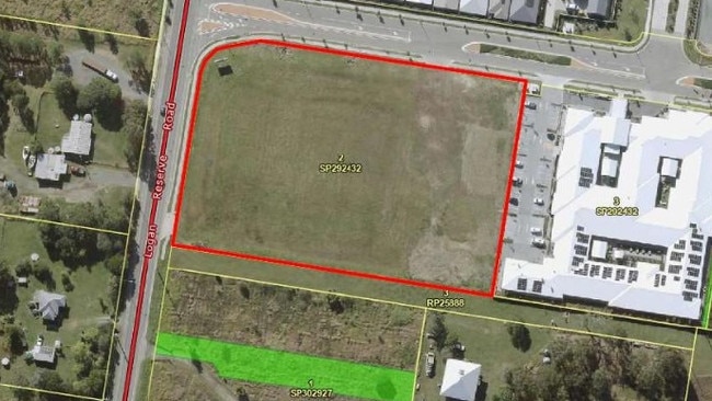 An aerial view of the shopping complex site in red with Arcare to the right and the 3.8m cemetery land between the complex and a proposed housing estate at the bottom of the photo.