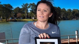 Katrina Umback with a photo of her husband Scott Umback who passed away in 2019. Photo: supplied