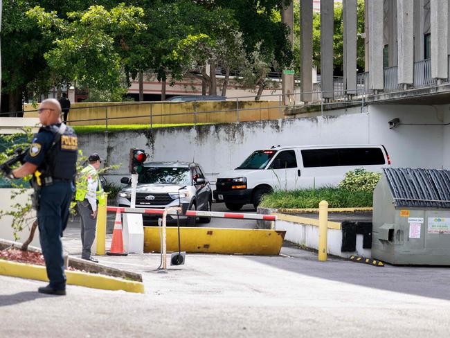 A heavy police presence surrounds the van carrying Ryan Wesley Routh as it is driven from the federal courthouse after he attended an initial appearance in West Palm Beach, Florida. Picture: Getty/AFP