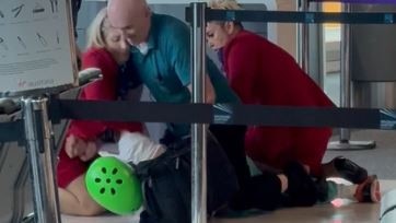 A man is wrestled to the ground in the Virgin terminal at Brisbane's domestic airport.