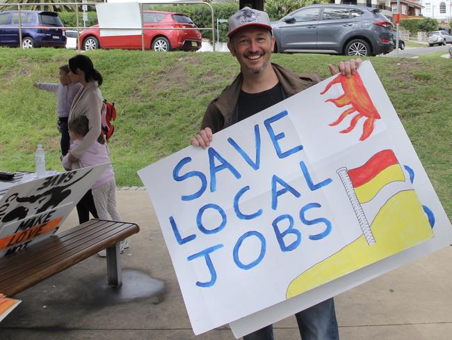 Owner of Stay Grounded cafe, Ryan O’Neill at the rally at Collaroy Beach. Picture: Monique Tyacke