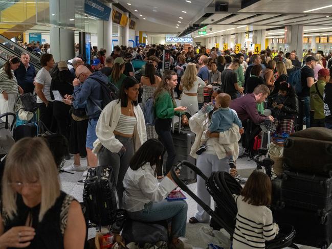 People wait near check-in desks at Gatwick Airport in Crawley, United Kingdom. Picture: Getty Images