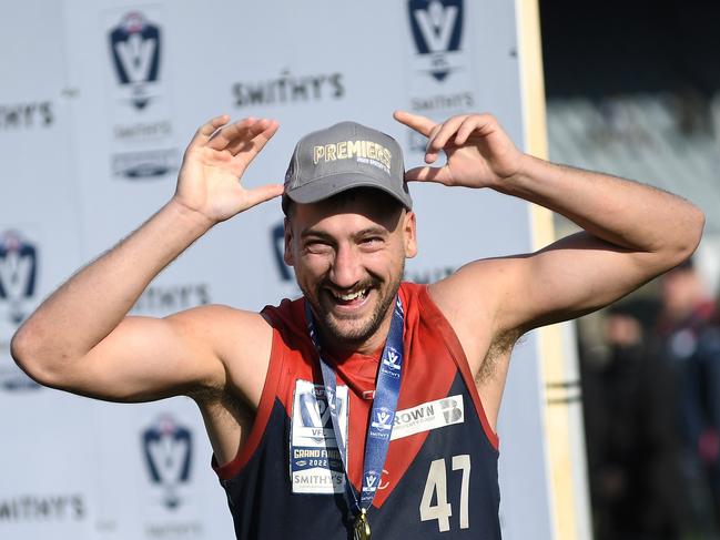 MELBOURNE, AUSTRALIA - SEPTEMBER 18: James Munro of the Casey Demons celebrates after the 2022 VFL Grand Final match between the Casey Demons and the Southport Sharks at Ikon Park on September 18, 2022 in Melbourne, Australia. (Photo by Felicity Elliott/AFL Photos via Getty Images)