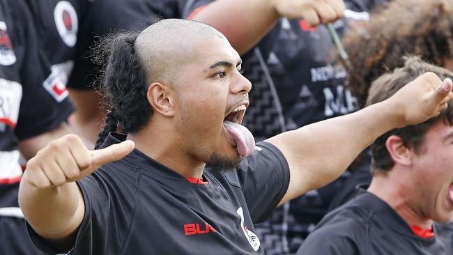 Amanaki Tangi joins his NSW Maori teammates performing the haka before the game.