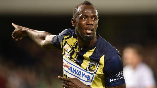 Usain Bolt celebrates after scoring a goal. Picture: AFP Photo