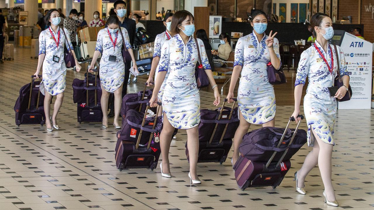 Airline staff wearing face masks to help prevent the spread of coronavirus at Brisbane International Airport, Qld, on Monday January 27, 2020. Picture: AAP