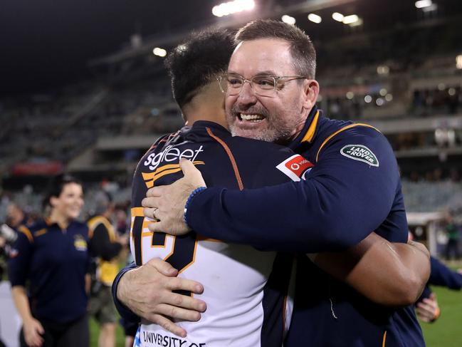 Brumbies coach Dan McKellar and Irae Simone of the Brumbies celebrate winning the Super Rugby AU grand final