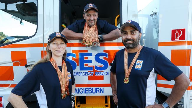 Craigieburn SES members Anita Lutz, Rob Reid and Harminder Singh with their medals. Picture: Ian Currie