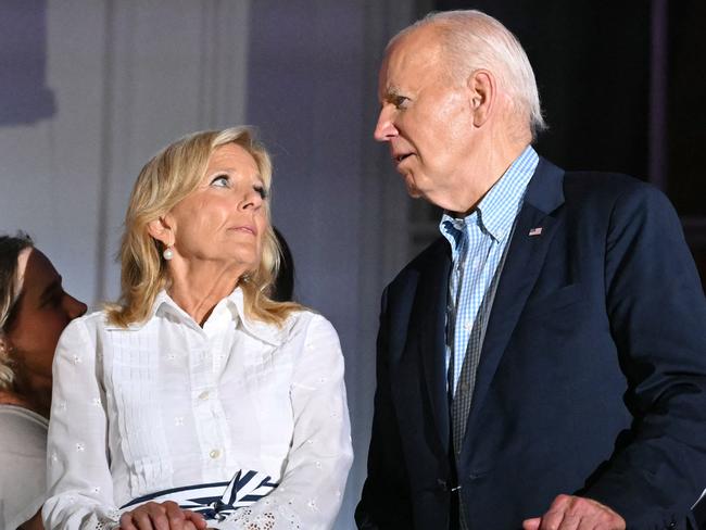 US President Joe Biden (R), First Lady Jill Biden and family watch the Independence Day fireworks display from the Truman Balcony of the White House in Washington, DC, on July 4, 2024. (Photo by Mandel NGAN / AFP)