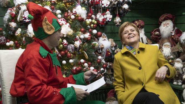 Nicola Sturgeon is interviewed by a journalist dressed as a Christmas elf in Crieff, Scotland. Picture: AP