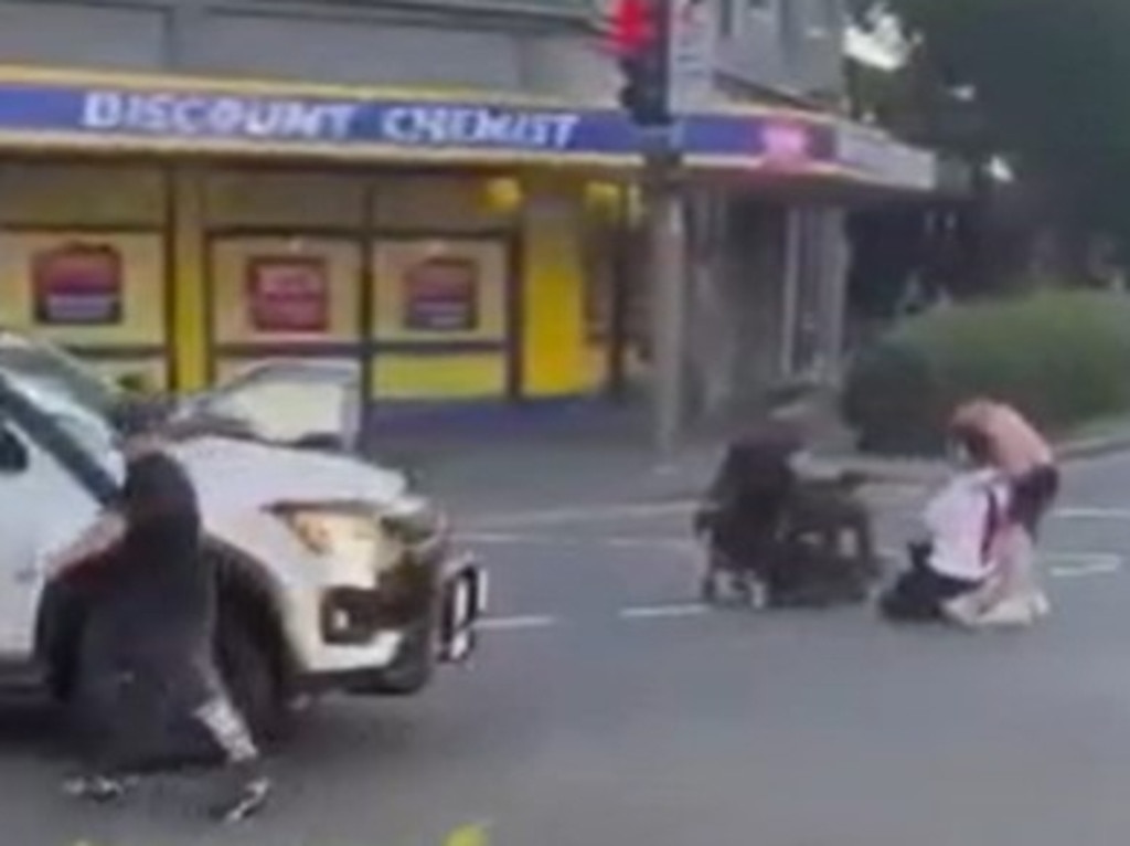 Bystanders rush to help a bleeding Acherkouk in the moments after he was shot. Picture: Supplied