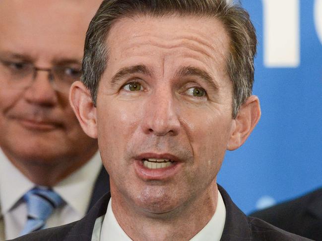 ADELAIDE, AUSTRALIA - NewsWire Photos FEBRUARY 25, 2022: Finance Minister Simon Birmingham addresses a press conference watched by Prime Minister Scott Morrison and South Australian Premier Steven Marshall at the Australian Space Agency. Picture: NCA NewsWire / Brenton Edwards