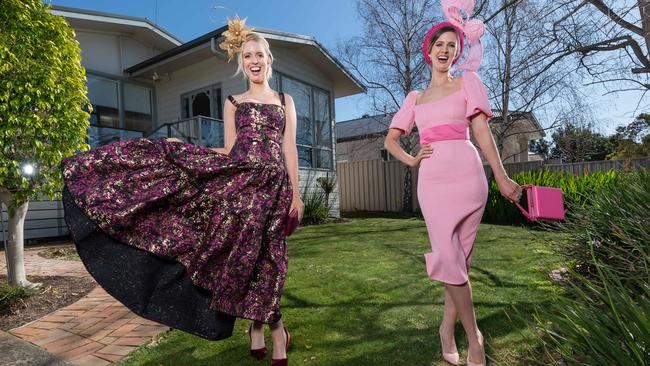 Sisters Andrea and Courtney Moore say it’s a good opportunity to wear outfits or headpieces you might not normally be brave enough to try. Picture: Jason Edwards