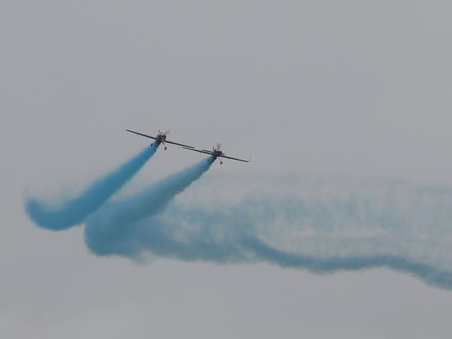 Fighter jets released blue smoke over Sydney Harbour to reveal the gender. Picture: John Grainger