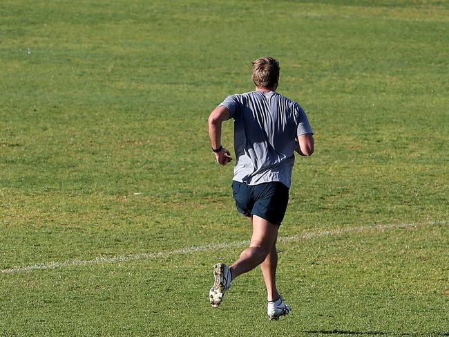 Adelaide Crows player, Daniel Talia exercising on Unley Oval on Wednesday. Picture: Sarah Reed.