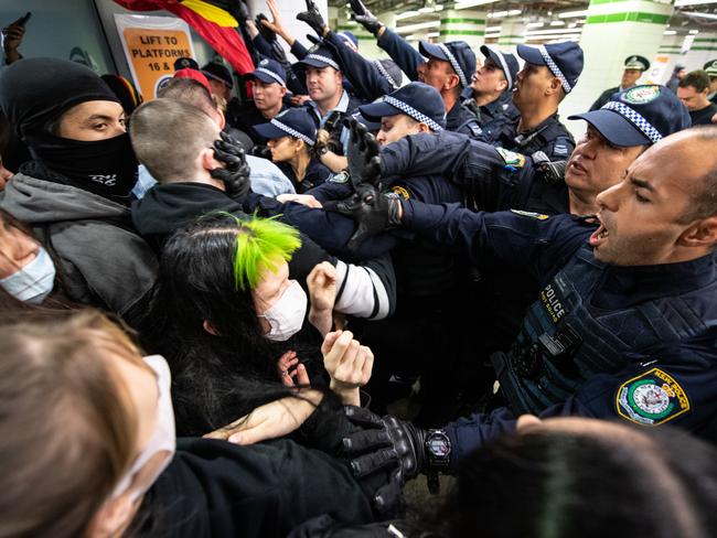 Police clashing with protestors inside Central Station after a Black Lives Matter rally in Sydney, Saturday, June 6, 2020.  A protest against the deaths of Aboriginal people in custody and solidarity with the US protests for George Floyd. (AAP Image/James Gourley) NO ARCHIVING