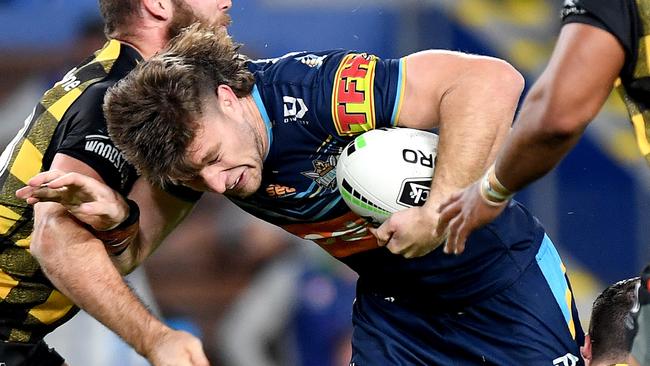 GOLD COAST, AUSTRALIA - JULY 10: Jai Arrow of the Titans takes on the defence during the round nine NRL match between the Gold Coast Titans and the New Zealand Warriors at Cbus Super Stadium on July 10, 2020 in Gold Coast, Australia. (Photo by Bradley Kanaris/Getty Images)