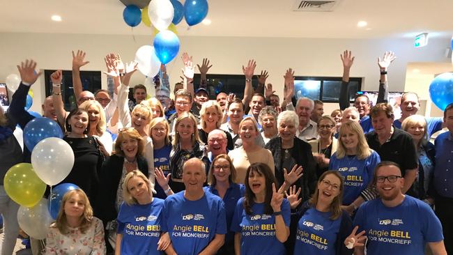 Angie Bell celebrates her victory in the seat of Moncrieff with her supporters at the Broadbeach Bowls Club.