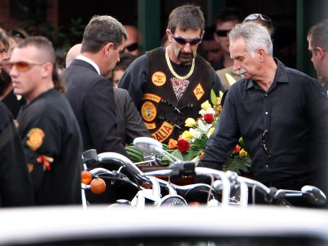 Bandidos members place the coffin in a sidecar at the Tuckers Funeral Home Geelong.