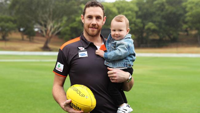 Shane Mumford with son Ollie at his retirement announcement. Picture: Brett Costello