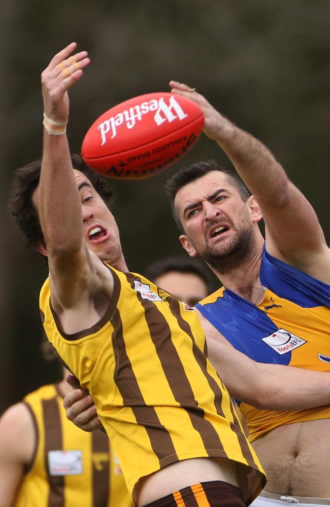 Dingley signing Vergim Faik (left) in a ruck contest for Noble Park.