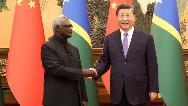 Chinese President Xi Jinping and Solomon Islands Prime Minister Manasseh Sogavare shake hands at the Great Hall of the People in Beijing on July 10. Picture: Supplied