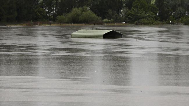 A shed swamped by the floodwaters off the Hawkesbury River. Picture: Adam Yip