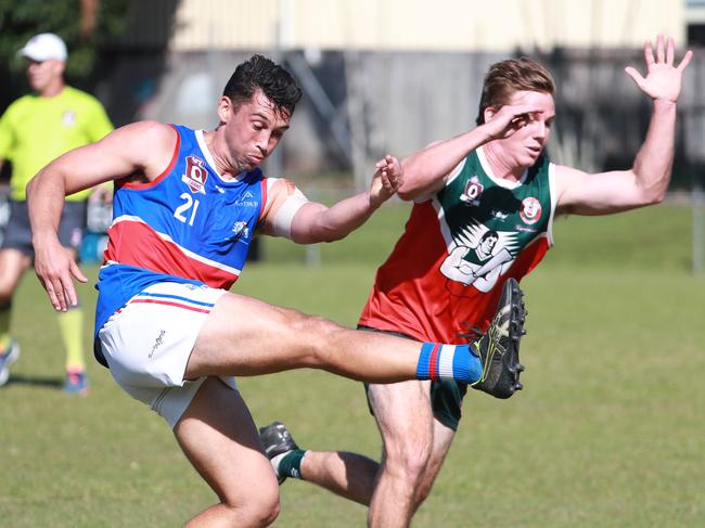 Bulldogs' Jackson Williams gets a kick away in the AFL Cairns Premiership Men's match between the South Cairns Cutters and Centrals Trinity Beach Bulldogs, held at Fretwell Park. Picture: Brendan Radke