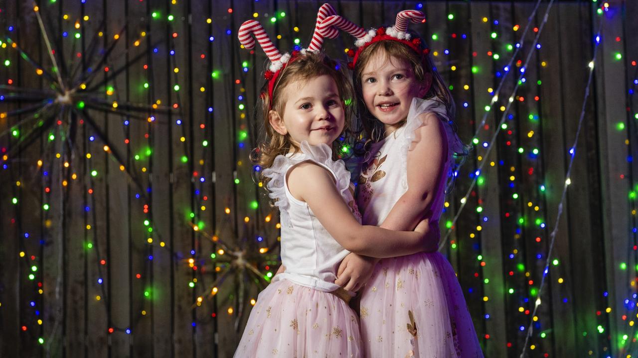 Sisters Everly (left) and Ottilie Rasmussen with the Christmas light display at their family home in Wyreema, Monday, December 13, 2021. Picture: Kevin Farmer