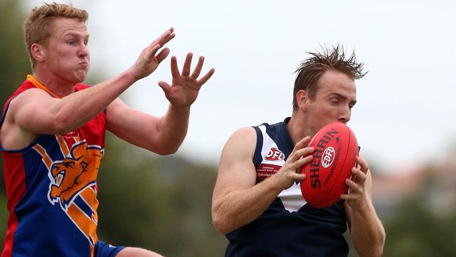 Sam O'Brien of Maribyrnong arrives too late to spoil Patrick Rose of Avondale during the EDFL match between Maribyrnong Park and Avondale Heights played at the Bouldevard in Moonee Ponds on Saturday 16th April, 2016. Picture: Mark Dadswell