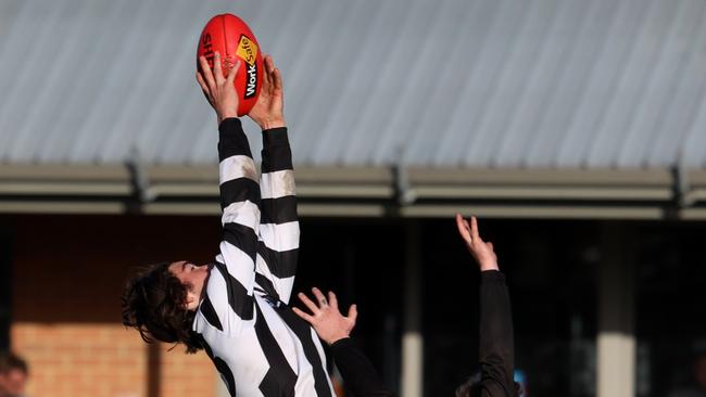 Jai Newcombe pulling in a mark for Poowong. Pic: George Morgan