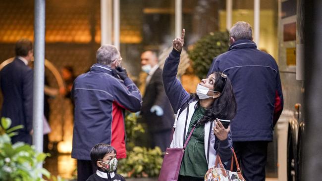 Citizens leave the Pullman Hotel, Adelaide after spending 14 days in isolation after arriving from overseas flights, Saturday July 11, 2020. Photo: MIKE BURTON