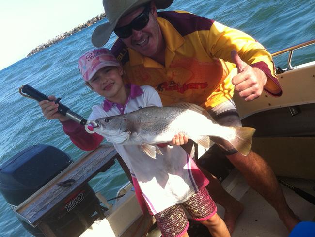 Herb Sechner with daughter Jasmine, 8, and her first jew fish caught on the Gold Coast on the north wall of the Seaway